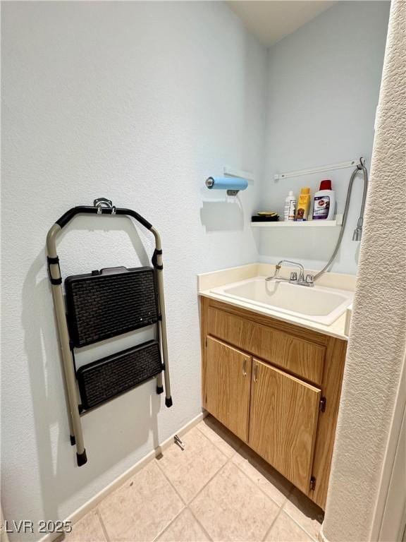 bathroom featuring vanity and tile patterned flooring