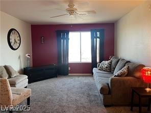 living area with carpet floors and a ceiling fan