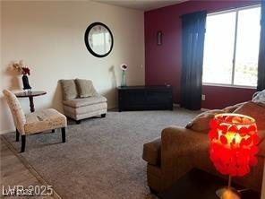 living area with carpet flooring
