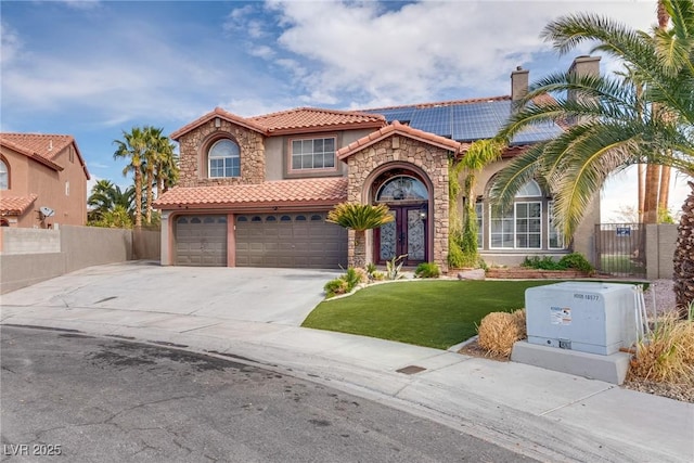 3924 Diamond Ridge St, Las Vegas, NV 89129 - mediterranean / spanish-style home featuring a tiled roof, stucco siding, stone siding, concrete driveway, and an attached garage
