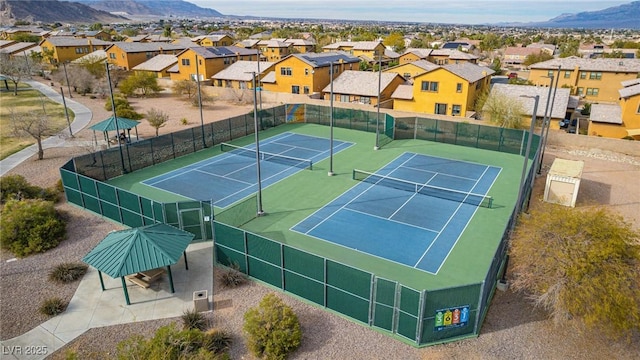 3924 Diamond Ridge St, Las Vegas, NV 89129 - view of tennis court with fence, a residential view, and a mountain view