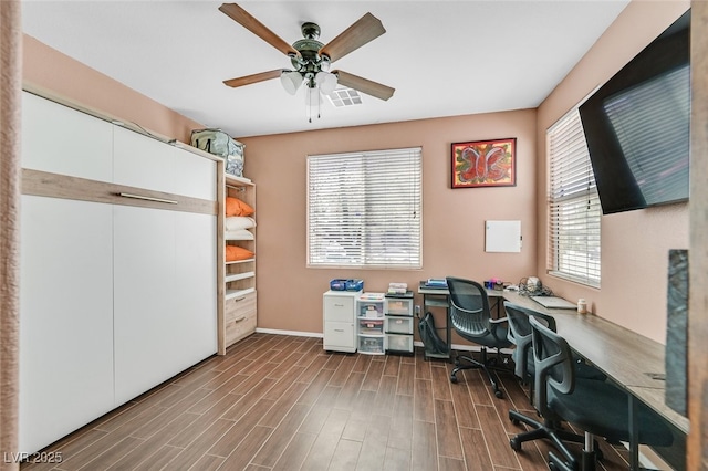 2104 Leatherbridge Ct, North Las Vegas, NV 89081 - office area featuring a ceiling fan, dark wood-type flooring, and baseboards