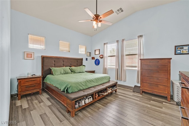 2104 Leatherbridge Ct, North Las Vegas, NV 89081 - bedroom with vaulted ceiling, light wood-type flooring, and a ceiling fan