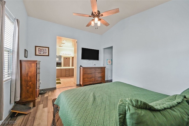 2104 Leatherbridge Ct, North Las Vegas, NV 89081 - bedroom with light wood-style floors, lofted ceiling, connected bathroom, and ceiling fan