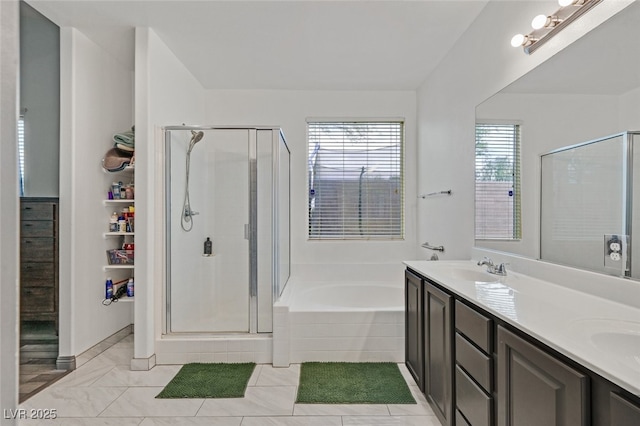 2104 Leatherbridge Ct, North Las Vegas, NV 89081 - bathroom featuring a stall shower, a garden tub, and double vanity
