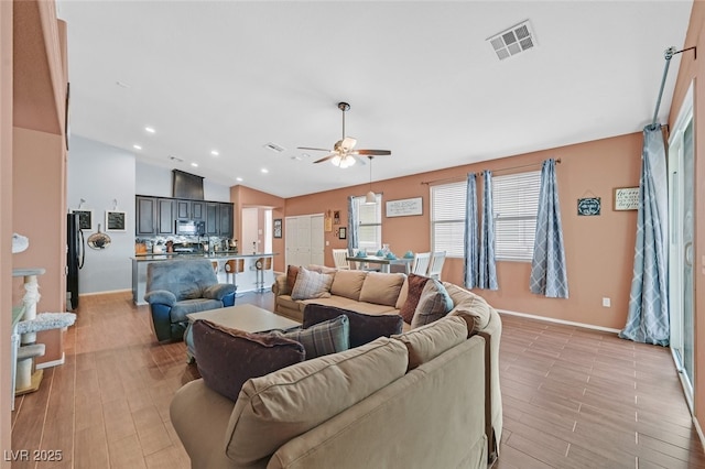 2104 Leatherbridge Ct, North Las Vegas, NV 89081 - living room featuring a ceiling fan, baseboards, light wood finished floors, recessed lighting, and lofted ceiling