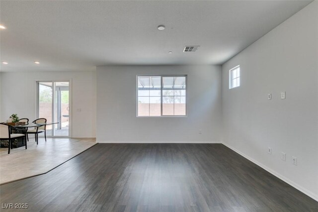 1004 Huckburn Ave, Henderson, NV 89015 - interior space featuring recessed lighting, visible vents, baseboards, and dark wood-style flooring