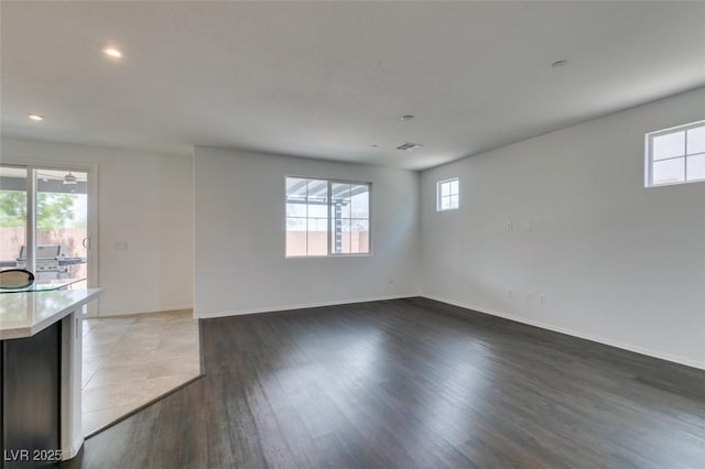 1004 Huckburn Ave, Henderson, NV 89015 - interior space featuring recessed lighting, wood finished floors, a wealth of natural light, and baseboards