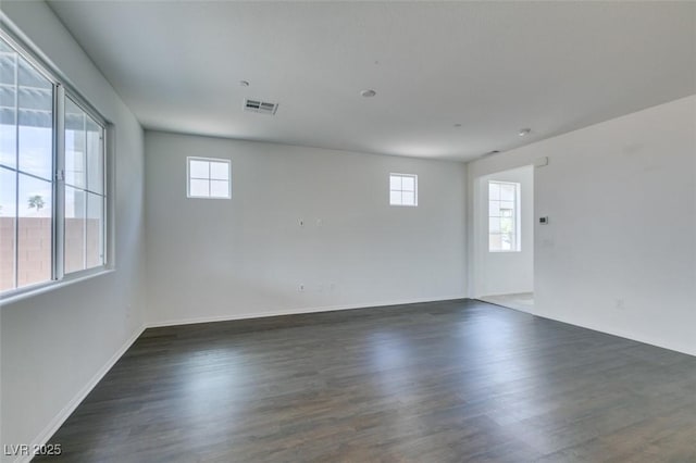 1004 Huckburn Ave, Henderson, NV 89015 - empty room featuring baseboards, wood finished floors, and visible vents