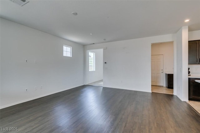1004 Huckburn Ave, Henderson, NV 89015 - unfurnished living room featuring recessed lighting, wood finished floors, and visible vents