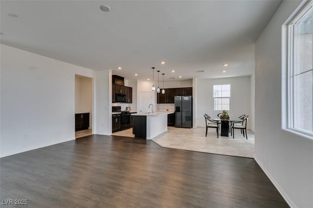1004 Huckburn Ave, Henderson, NV 89015 - living room featuring recessed lighting and light wood-style floors