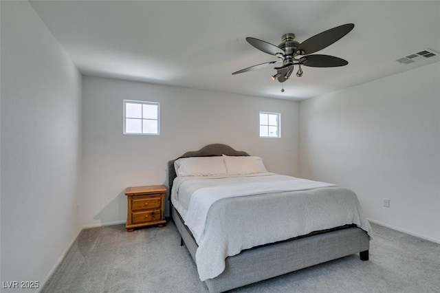 1004 Huckburn Ave, Henderson, NV 89015 - carpeted bedroom featuring visible vents, baseboards, and multiple windows