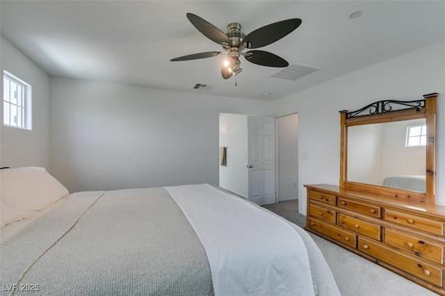 1004 Huckburn Ave, Henderson, NV 89015 - bedroom featuring visible vents, light carpet, and multiple windows