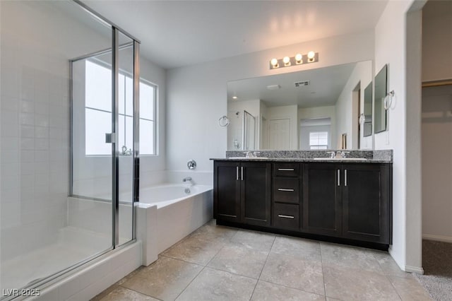 1004 Huckburn Ave, Henderson, NV 89015 - full bathroom featuring plenty of natural light, a sink, and a stall shower