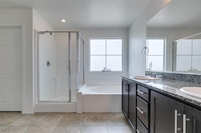 1004 Huckburn Ave, Henderson, NV 89015 - full bath with a stall shower, a bath, a sink, and a healthy amount of sunlight