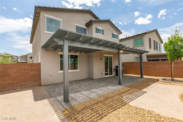 1004 Huckburn Ave, Henderson, NV 89015 - rear view of property with fence, a pergola, and stucco siding