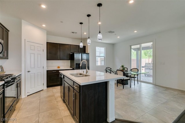 1004 Huckburn Ave, Henderson, NV 89015 - kitchen with appliances with stainless steel finishes, a sink, visible vents, and recessed lighting