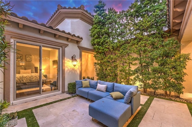 patio terrace at dusk with an outdoor hangout area