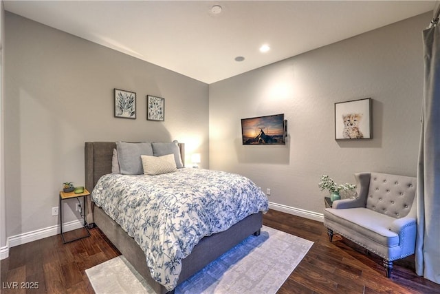 bedroom with wood finished floors, baseboards, and recessed lighting