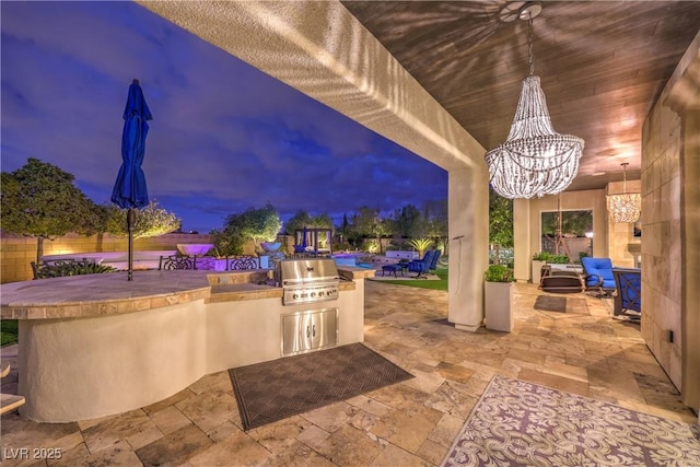 view of patio featuring exterior kitchen, an outdoor bar, and area for grilling