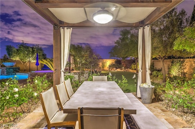 view of patio with outdoor dining space and fence private yard