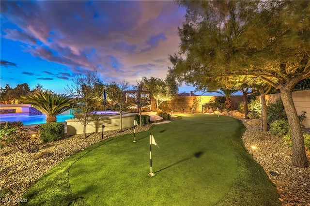 view of property's community featuring a pool and a fenced backyard