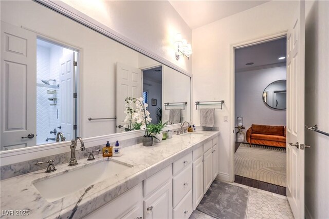 ensuite bathroom featuring ensuite bathroom, a sink, and double vanity