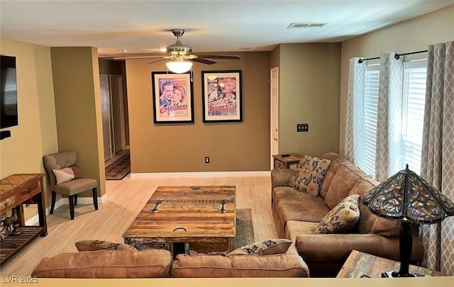 1121 Majestic Canyon St, Henderson, NV 89052 - living room featuring baseboards, a ceiling fan, visible vents, and wood finished floors