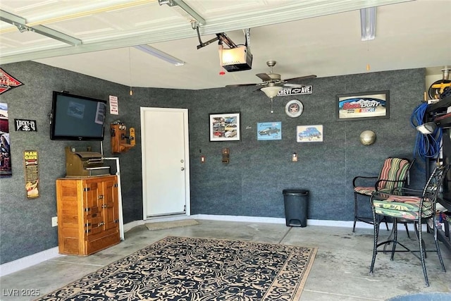 1121 Majestic Canyon St, Henderson, NV 89052 - garage featuring baseboards, a ceiling fan, and a garage door opener
