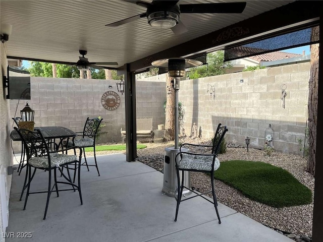 1121 Majestic Canyon St, Henderson, NV 89052 - view of patio / terrace featuring a ceiling fan, outdoor dining area, and fence