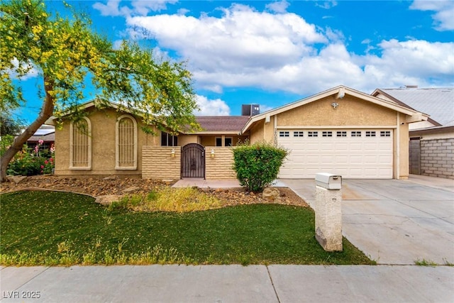 ranch-style home featuring concrete driveway, an attached garage, a front lawn, and stucco siding