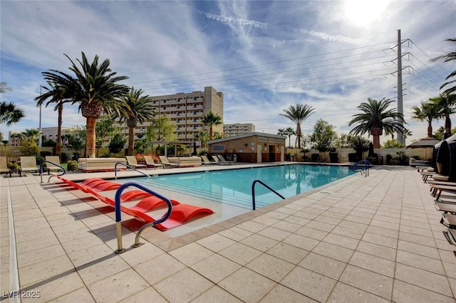 pool featuring a patio area and fence