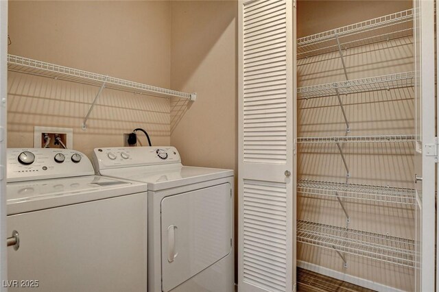 washroom with laundry area and independent washer and dryer