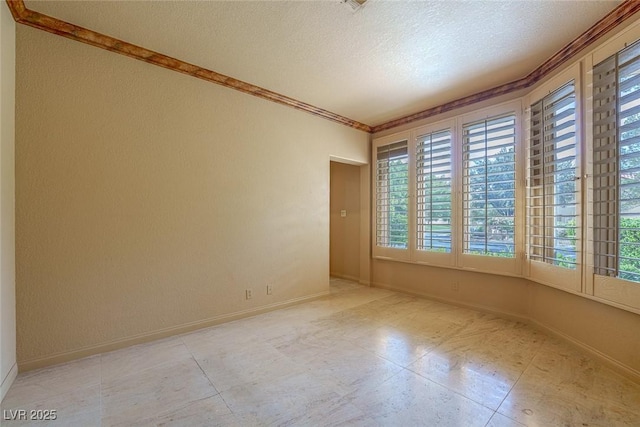 8199 Pinnacle Peak Ave, Las Vegas, NV 89113 - unfurnished room featuring healthy amount of natural light, a textured ceiling, ornamental molding, baseboards, and light tile patterned floors