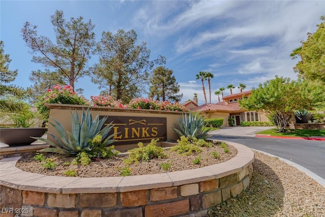 8199 Pinnacle Peak Ave, Las Vegas, NV 89113 - community sign with asphalt driveway and an attached garage