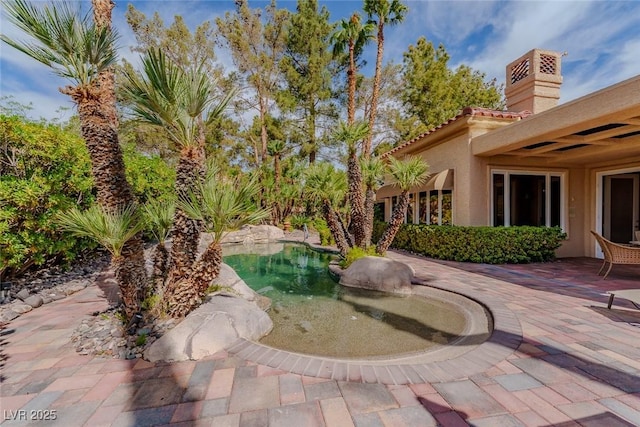 8199 Pinnacle Peak Ave, Las Vegas, NV 89113 - surrounding community featuring a patio area
