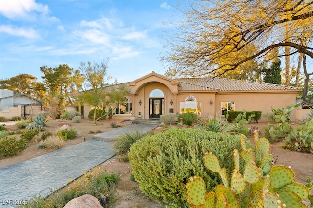 1234 Campbell Dr, Las Vegas, NV 89102 - view of front of house with a tile roof, french doors, and stucco siding