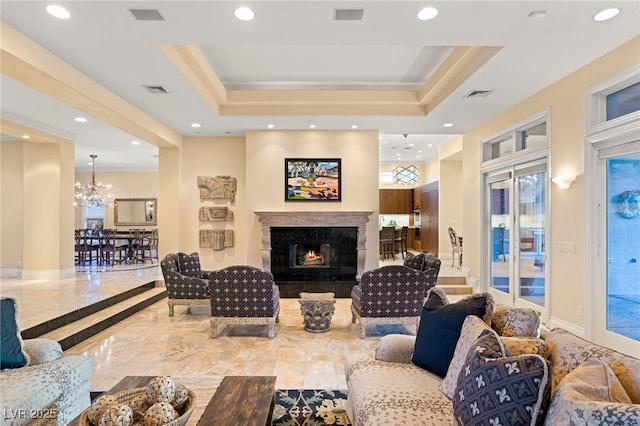 1234 Campbell Dr, Las Vegas, NV 89102 - living area featuring recessed lighting, a tray ceiling, visible vents, and an inviting chandelier