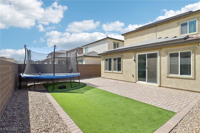 2877 Sweeping Palm Rd, North Las Vegas, NV 89086 - view of yard with a trampoline and a patio area