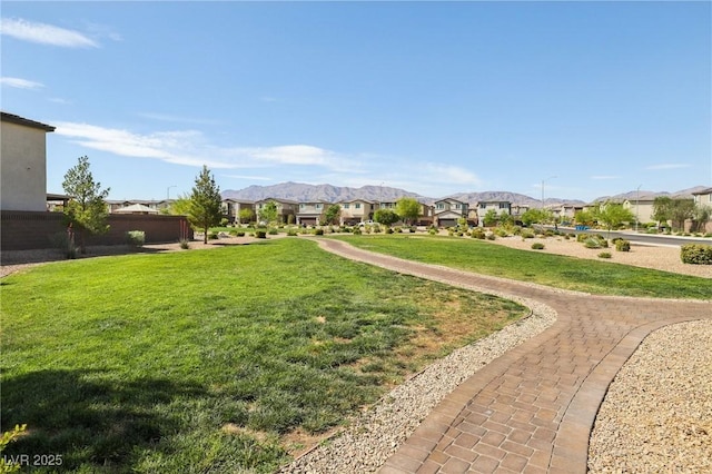 2877 Sweeping Palm Rd, North Las Vegas, NV 89086 - view of property's community with a residential view, a yard, and a mountain view
