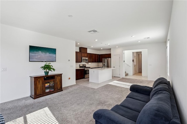 2877 Sweeping Palm Rd, North Las Vegas, NV 89086 - living area with light carpet and recessed lighting