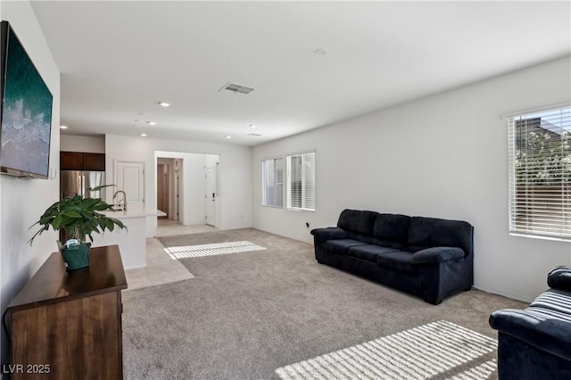 2877 Sweeping Palm Rd, North Las Vegas, NV 89086 - living room featuring light colored carpet and recessed lighting