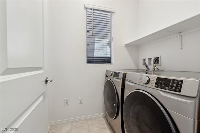 2877 Sweeping Palm Rd, North Las Vegas, NV 89086 - laundry room with washer and dryer, baseboards, and light tile patterned floors