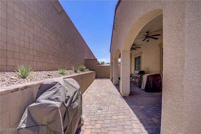 view of patio / terrace featuring a fenced backyard and ceiling fan