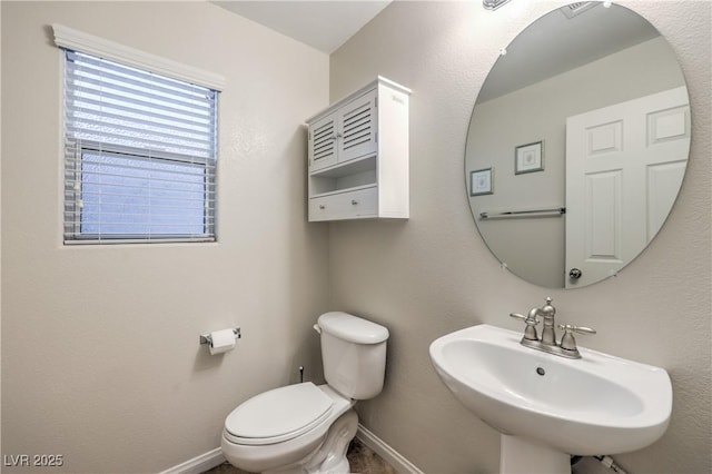 6546 American Flower St, Las Vegas, NV 89148 - bathroom with a sink, toilet, and baseboards