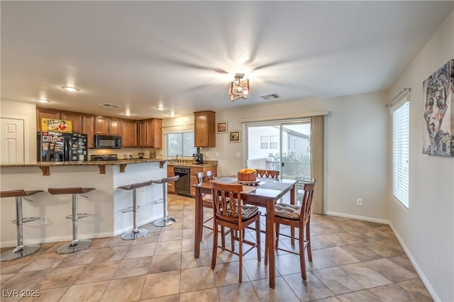 6546 American Flower St, Las Vegas, NV 89148 - dining room featuring baseboards
