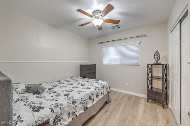 6546 American Flower St, Las Vegas, NV 89148 - bedroom with light wood-style flooring, a closet, baseboards, and ceiling fan