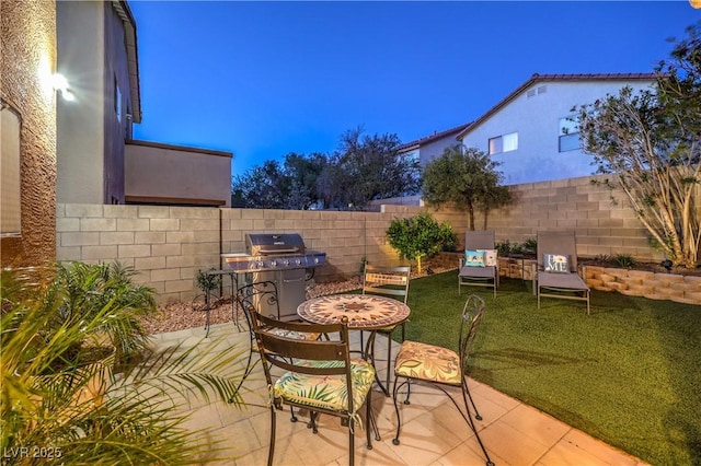6546 American Flower St, Las Vegas, NV 89148 - view of patio with area for grilling and fence