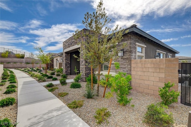 897 Woodburn Ln, Las Vegas, NV 89138 - view of property exterior with stone siding and stucco siding