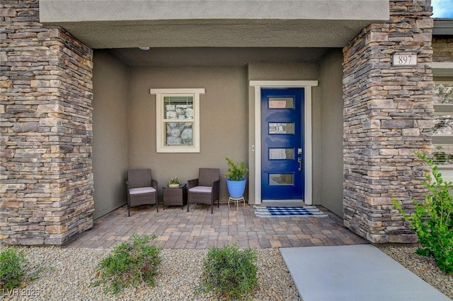 897 Woodburn Ln, Las Vegas, NV 89138 - view of exterior entry with stucco siding and stone siding
